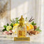 Dunhill Desire perfume bottle with floral and fruit elements on a light background