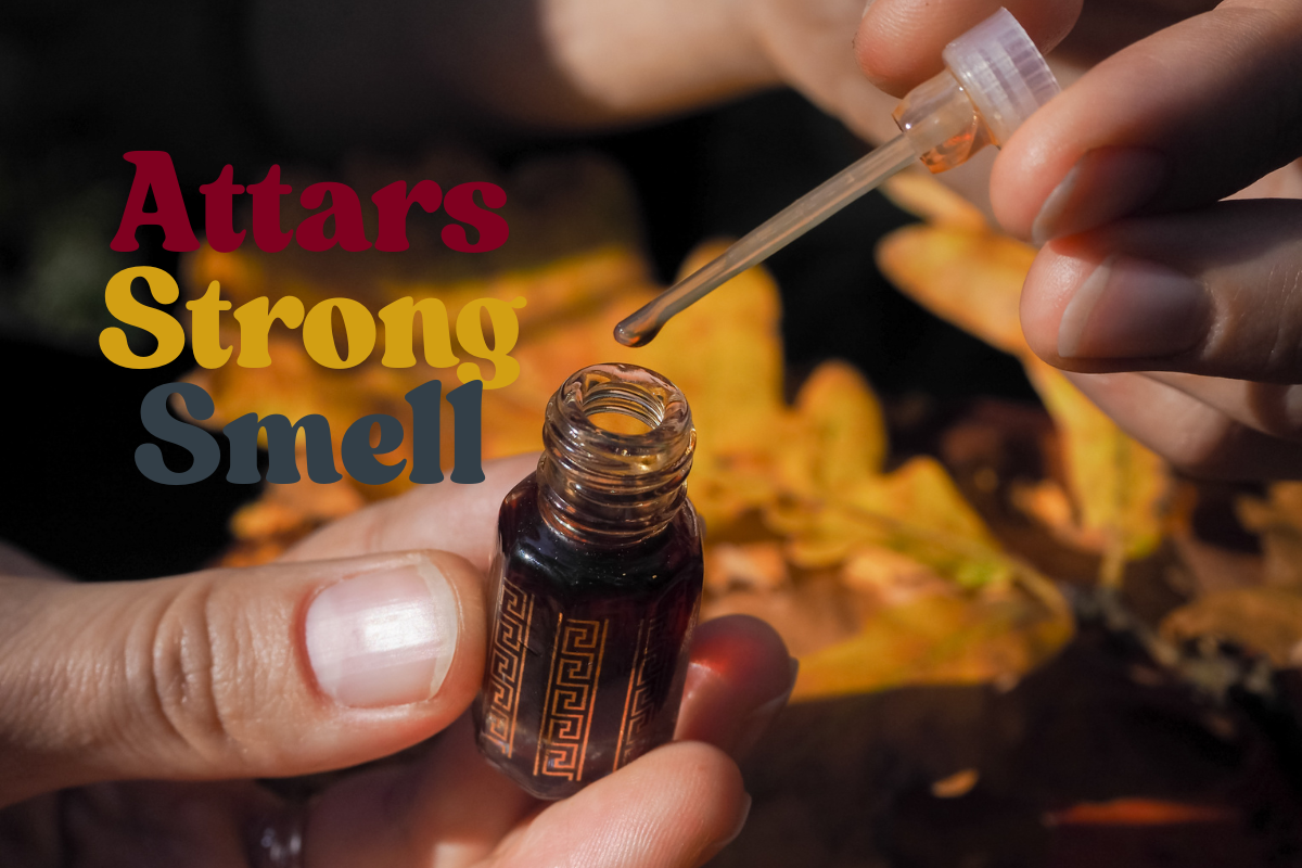 A close-up shot of hands holding a small ornate bottle of attar with a dropper, with warm autumn leaves in the background. Text overlay reads 'Attars Strong Smell' in bold colors.
