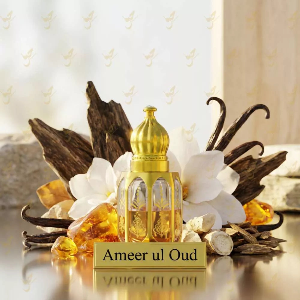 Gold Ameer ul Oud perfume bottle with vanilla beans and flowers on a reflective surface. Main image