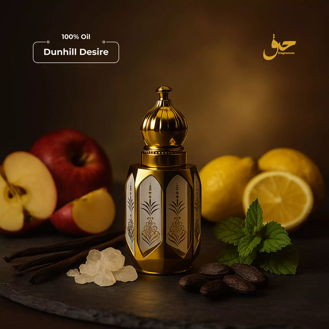 Dunhill Desire oil bottle with apples, lemons, vanilla beans, and chocolate on a dark background - Haq Fragrances