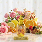 Gold perfume bottle labeled 'Versace Pink' with flowers, fruits, and spices on a white background
