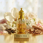 Gold perfume bottle labeled 'White Oud' surrounded by flowers, oud sticks and cinnamon sticks on a light background